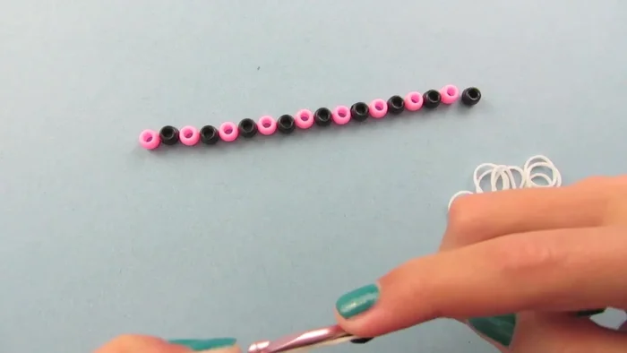 Place the other loop back onto the bead.