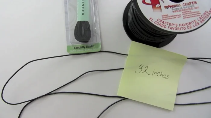 Cut 32 inches of round cord elastic or Sky strings.