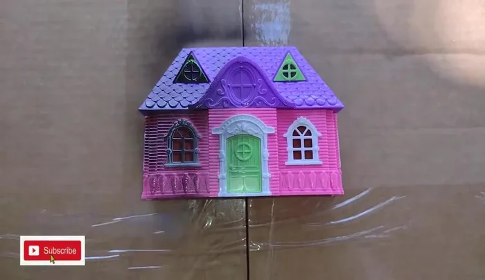 Apply a light coat of black spray paint to the inside of the dollhouses.