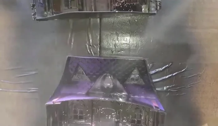 Apply a light coat of black spray paint to the inside of the dollhouses.