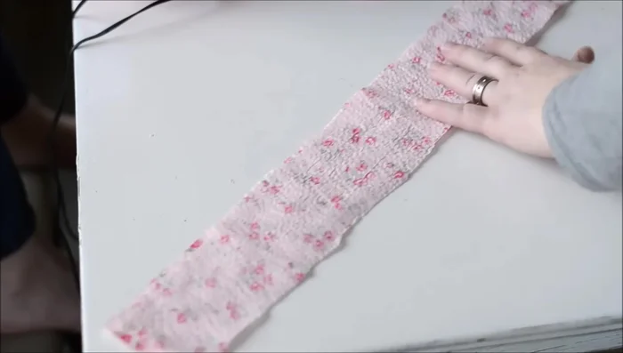 Sew the straps: Place the two handle pieces right sides together and pin. Sew along both long sides with a 1/2-inch seam allowance. Turn right side out, using a knitting needle if needed.