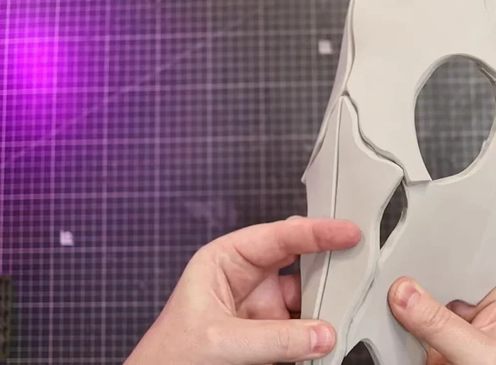 Glue Part D to the underside of Part A and inside of the skull.