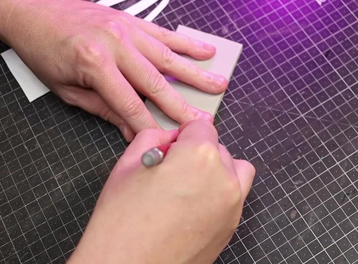 Glue Part D to the underside of Part A and inside of the skull.