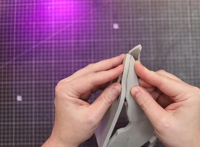 Glue Part D to the underside of Part A and inside of the skull.