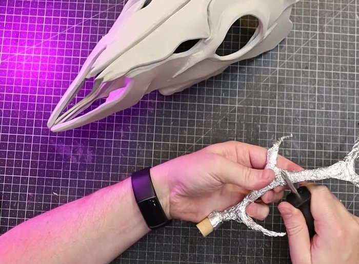 Add small strips of foam, and then use foam clay to bulk out and smooth the antler bases.