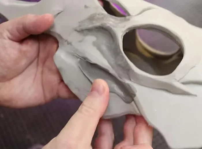 Sand the dried foam clay on the antlers, then use a wire brush to add bone-like texture.