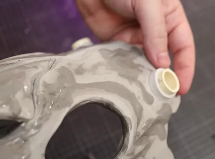 Add small strips of foam, and then use foam clay to bulk out and smooth the antler bases.