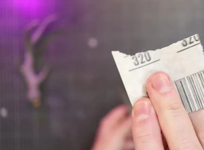 Sand the dried foam clay on the antlers, then use a wire brush to add bone-like texture.