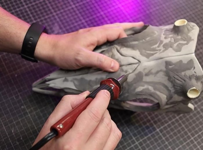 Use a wire brush to add texture and pores to the skull.