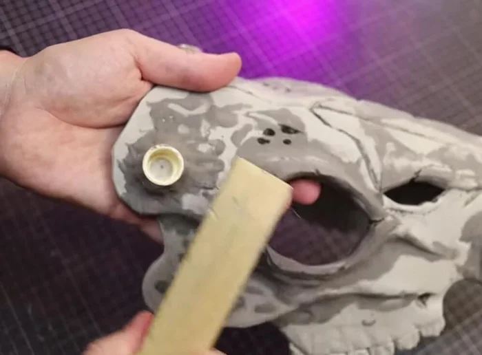Use a wire brush to add texture and pores to the skull.