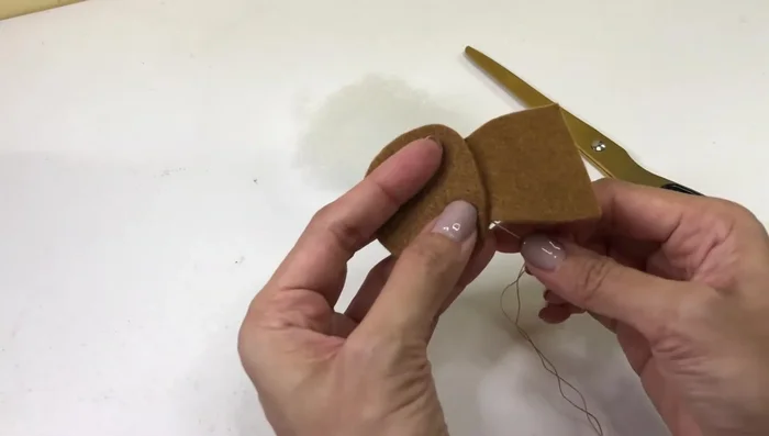 Glue the ears to the head.