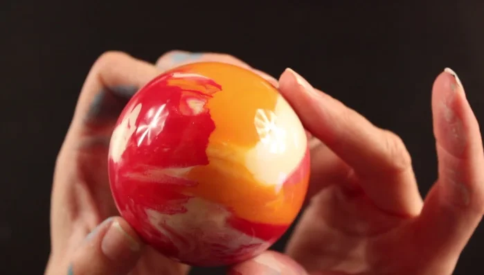 Carefully replace the top of the ornament.