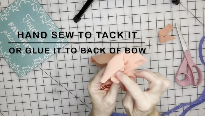 Trim the excess fabric and secure the ends with glue or stitches.