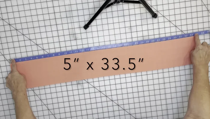 Cut your fabric 5 inches wide (or 3 inches for a smaller bow) by the calculated length.