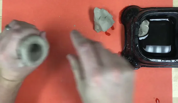 Shape the pinch pot into a penguin body: Ensure it's hollow to prevent cracking in the kiln.