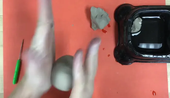 Shape the pinch pot into a penguin body: Ensure it's hollow to prevent cracking in the kiln.