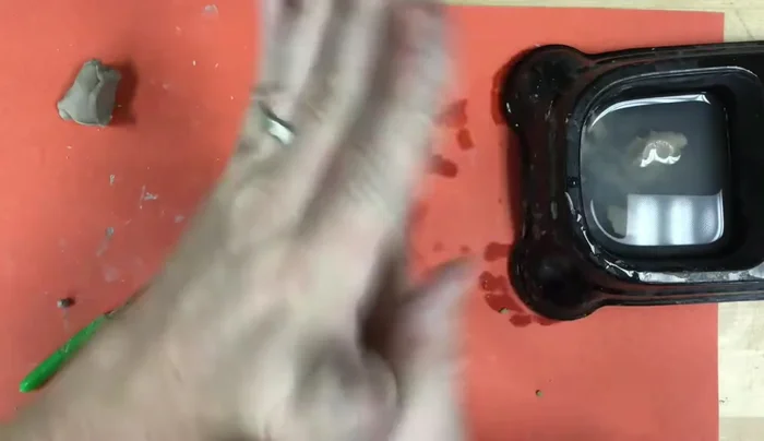 Add a guitar: Demonstrate creating a small guitar using coils and balls of clay, showing how to refine the shape through pinching, pressing, and scratching.