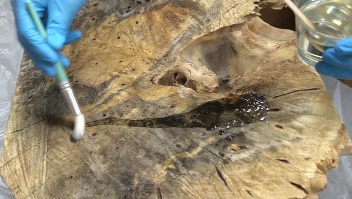 Seal the Burl: Apply two layers of penetrating epoxy, followed by a layer of tabletop epoxy.