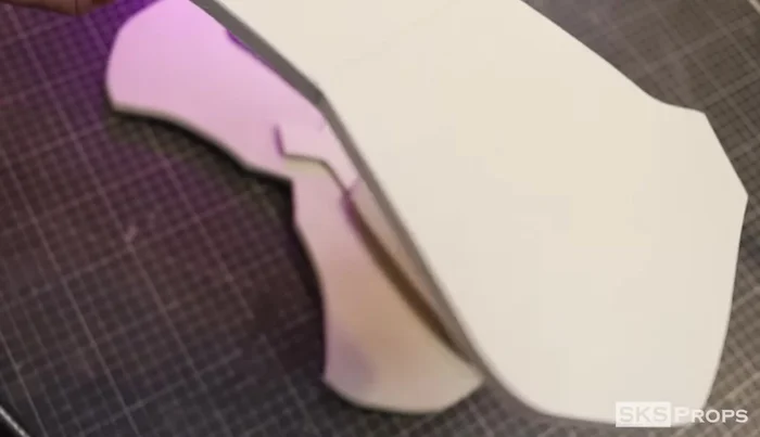 Glue the corners of Part C to the backside of Part E to create a rounded shape.