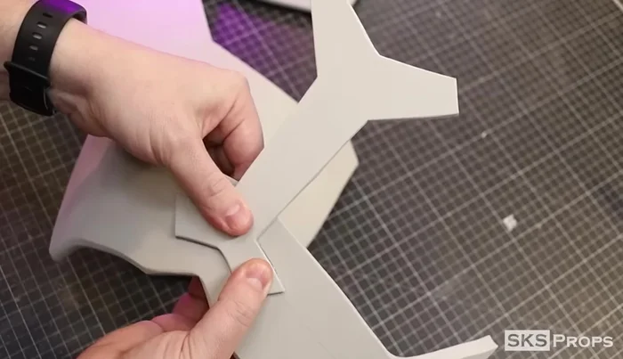 Glue the corners of Part C to the backside of Part E to create a rounded shape.