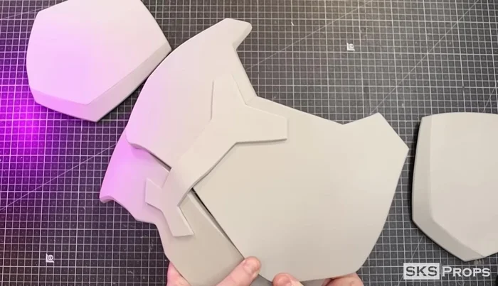 Glue the corners of Part C to the backside of Part E to create a rounded shape.