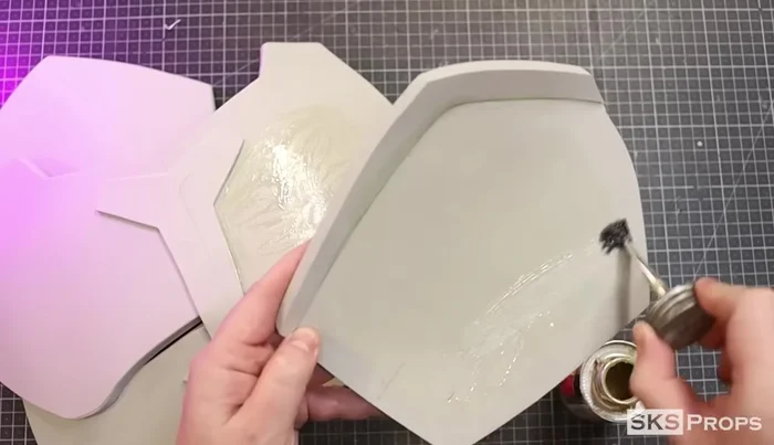 Glue the pectoral armor (Parts A & B) to the assembled upper chest pieces (Parts C, D, E) using Weldwood contact cement.