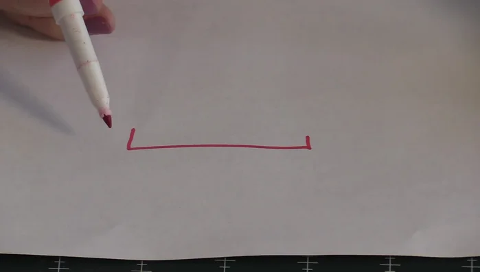 Tuck the seam allowance inside using thumb pressure while pulling the stitching thread closed.