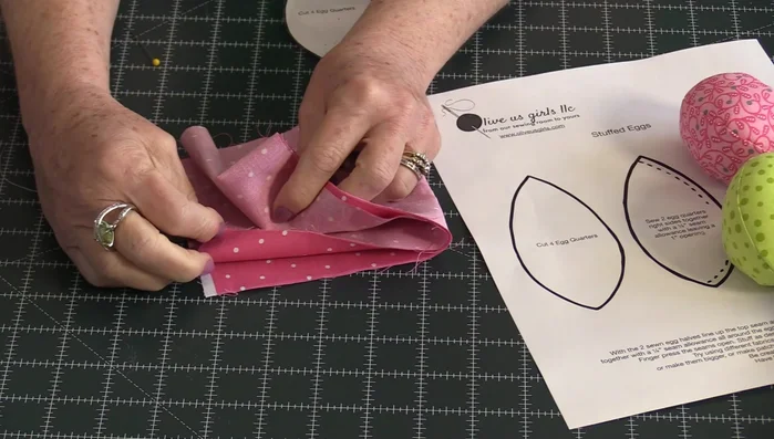 Cut four identical egg shapes from fabric, with right sides facing.
