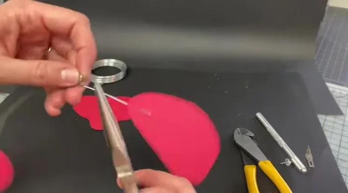 Attach the connection ring to the bottom mobile arm.