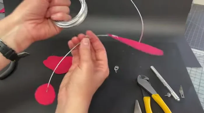 Add more arms. Repeat steps 2-5, attaching each new arm to a previously created connection ring. Determine each new arm's balance point before attaching.
