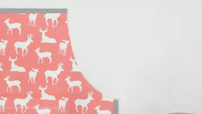 Create waist ties: Measure and cut 30 inches of bias tape for each waist tie. Pin the bias tape to the wrong side of the curved edges of the apron, leaving the ends free to create ties. Stitch in the crease.