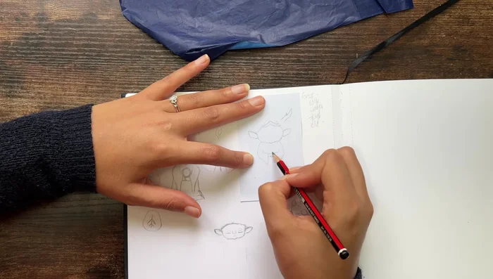 Trace drawing onto wood using transfer paper.