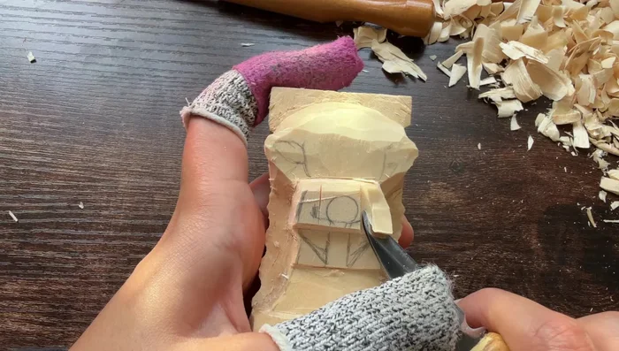 Refine the overall shape, removing excess wood and paying attention to detail.