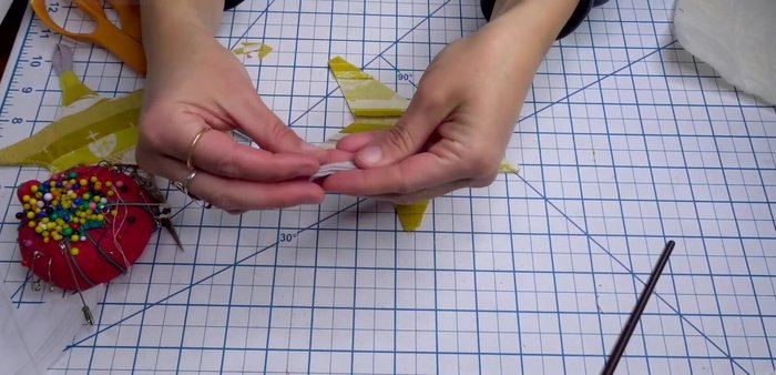 Position the star fabric on top of the batting and pin.