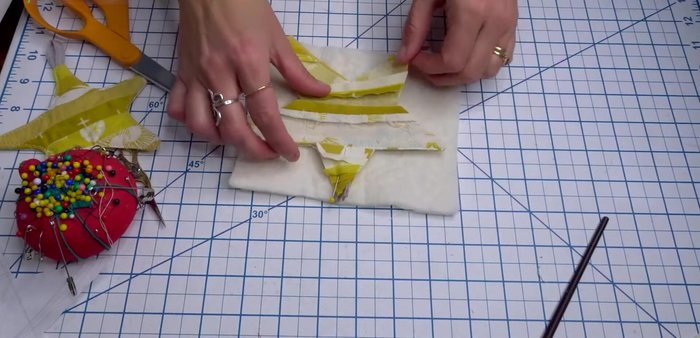 Position the star fabric on top of the batting and pin.