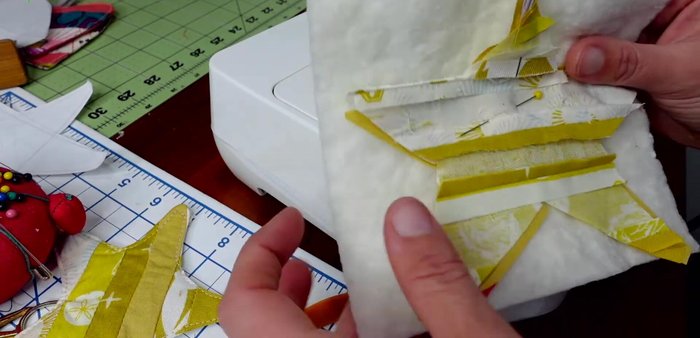 Cut out the star from the batting, making small snips in the curves to help it lay flat. Turn the star right side out using a chopstick or pencil.