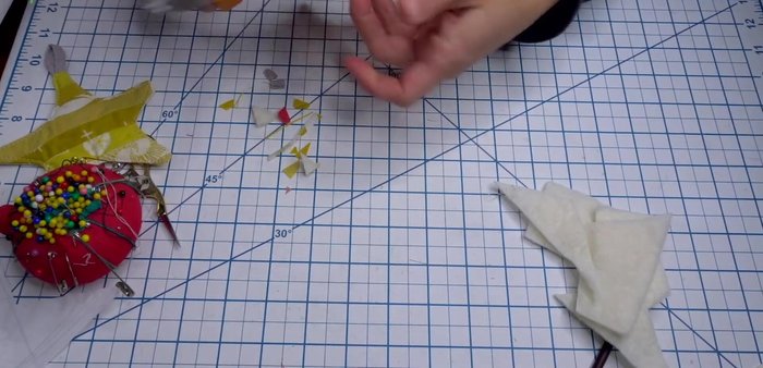 Cut out the star from the batting, making small snips in the curves to help it lay flat. Turn the star right side out using a chopstick or pencil.
