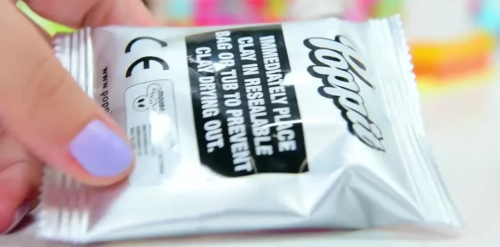 Prepare the clay: Roll pink clay into balls for the milkshake base and strawberry pieces. Create small white clay balls for the cream.