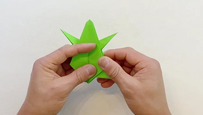 Open one side from the bottom, then the other, creating flat surfaces.