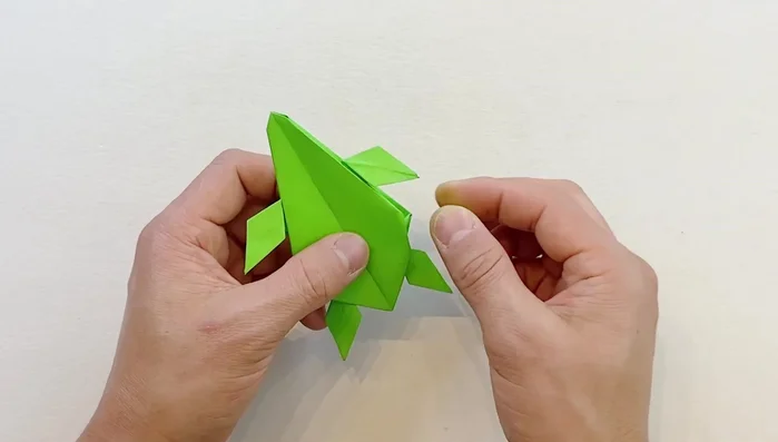 Make the pointy ends rounder by folding inward on both top and bottom sides.