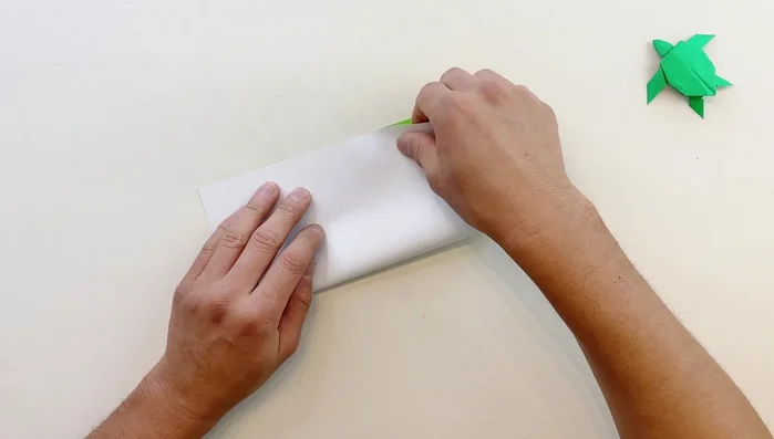 Fold diagonally in both directions.