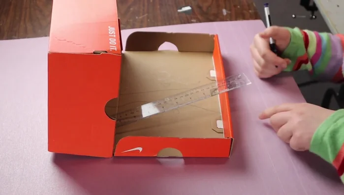 Glue the styrofoam base into the shoebox.