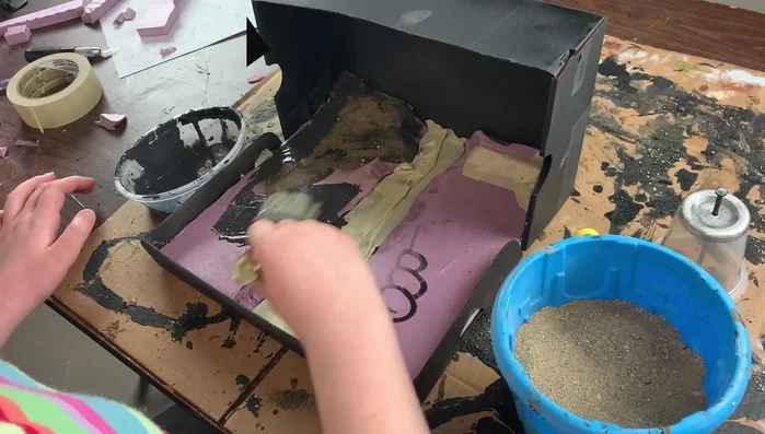 Mist with rubbing alcohol to help set the grit.