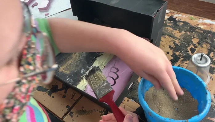 Mist with rubbing alcohol to help set the grit.