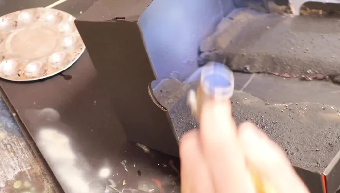 Airbrush the river with shades of green and yellow.