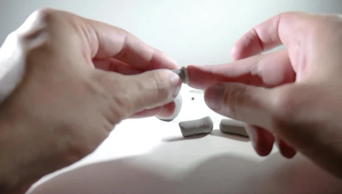 Add flat white clay balls to the bottom of each leg to create hooves.