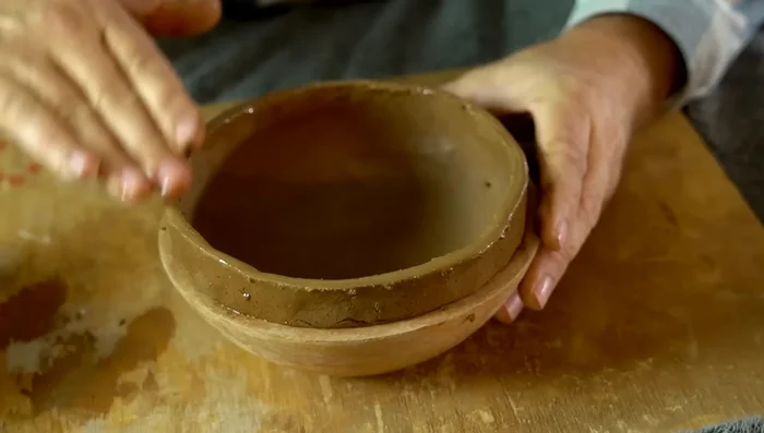 Dampen the rim and shape it with wet fingers.