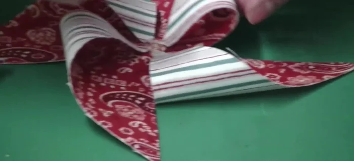 Glue a button to the center of the pinwheel to cover the glue.