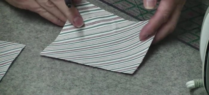 Cut along the diagonal lines up to the half-inch marks.