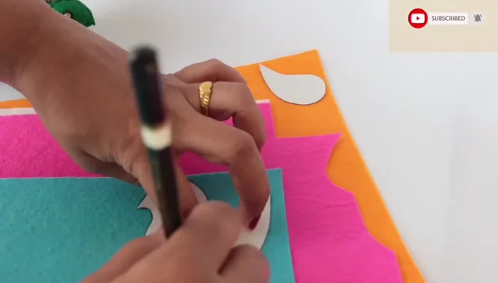 Trace the template onto felt pieces (two of each part).